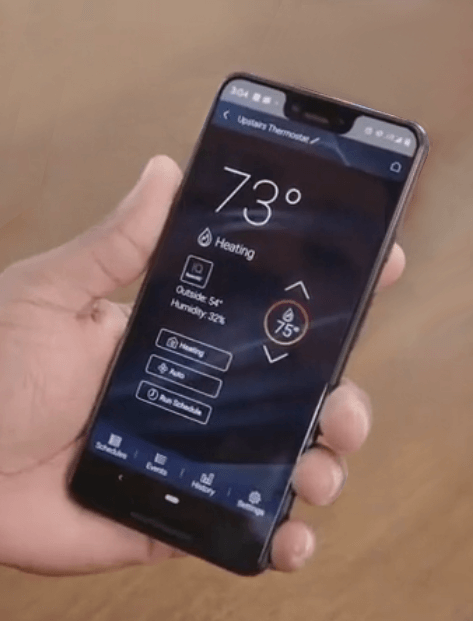 hand holding phone showing American Standard Home app